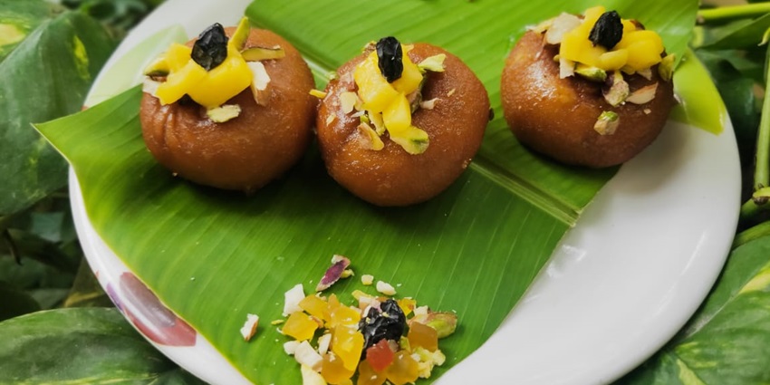 Balushahi is a sweet made with flour and a mixture of khoya, cardamom, and saffron.