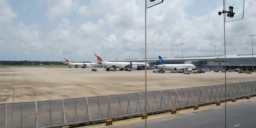 Aerial view of Bandaranaike International Airport with planes on the runway.