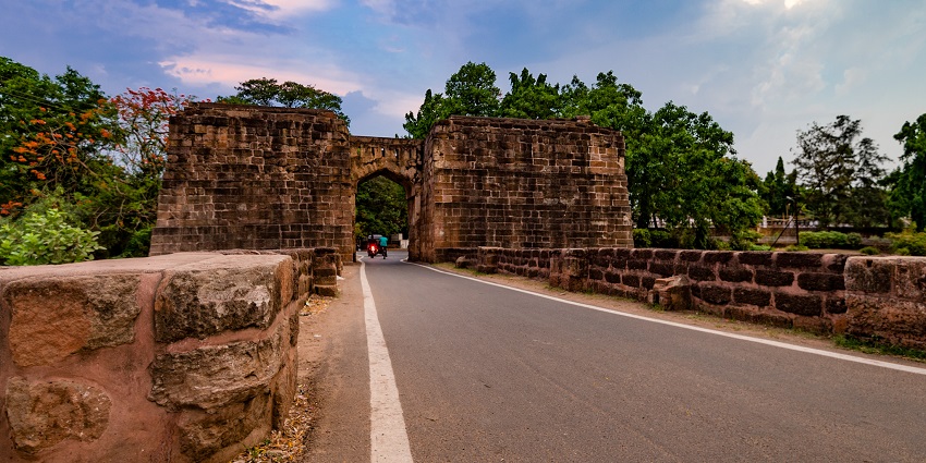 Barabati Fort in Cuttack with ancient stone walls, arched gateways, and green surroundings.