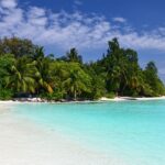 The Scenic snapshot of the sandy Bathala beach under the clear blue sky of Maldives