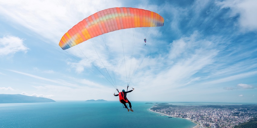 Snapshot of the skydiver, taking a leap from the plane—Skydiving in Singapore