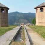 A scenic view of the Bhaderwah Fort with its two castles on either side