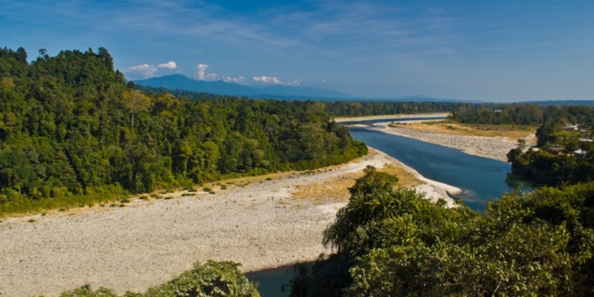 A serene view of the lush greenery, azure waters and pristine trails of Bhalukpong.