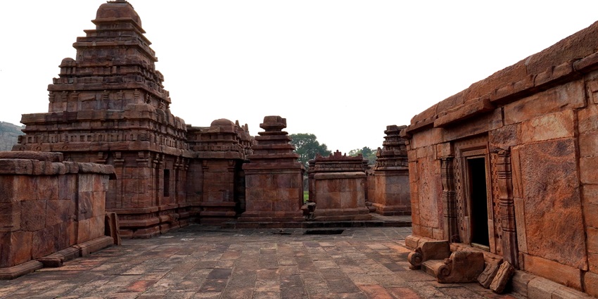 A picture of an ancient temple with traditional architecture and intricate wall carvings