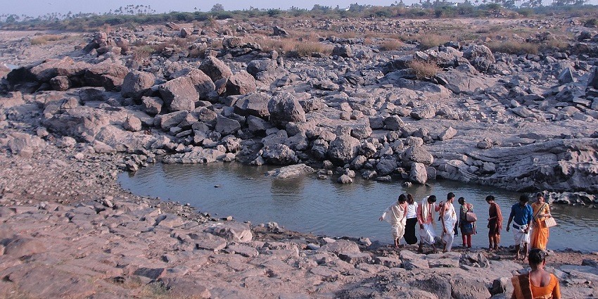 View of a river amidst rocks in this village offering a serene sight to sit and relax