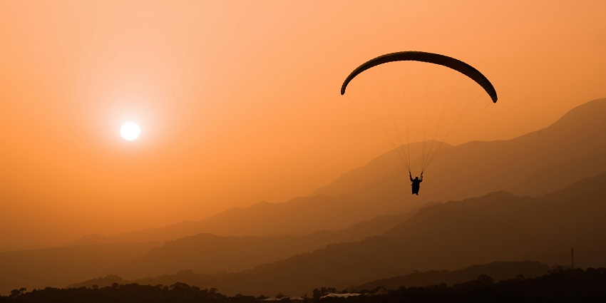 A view of a person swinging high up in the air in Bir Billing, in Himachal Pradesh.