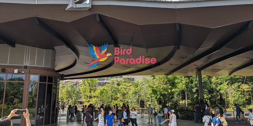 Bird Paradise entrance, with vibrant signage and lush landscaping, welcoming visitors.