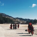 Scenic view of Bomdila with young monks in traditional robes - places to visit in Bomdila.