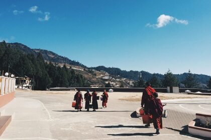 Scenic view of Bomdila with young monks in traditional robes - places to visit in Bomdila.