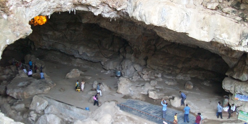 Borra Caves feature impressive stalactites and stalagmites amidst vibrant nature.