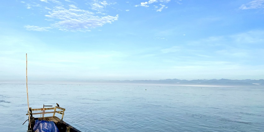 Picturesque view of Brahmaputra River clear blue sky - Places to visit in Guwahati.