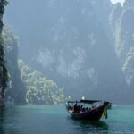 A scenic view of people enjoying a boat ride at the Khao Sok National Park, Thailand.