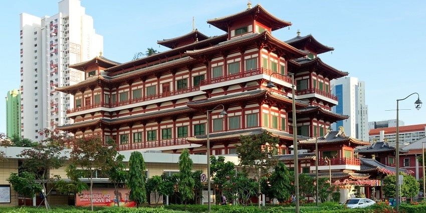A picture of a Buddha temple from across the street in Singapore