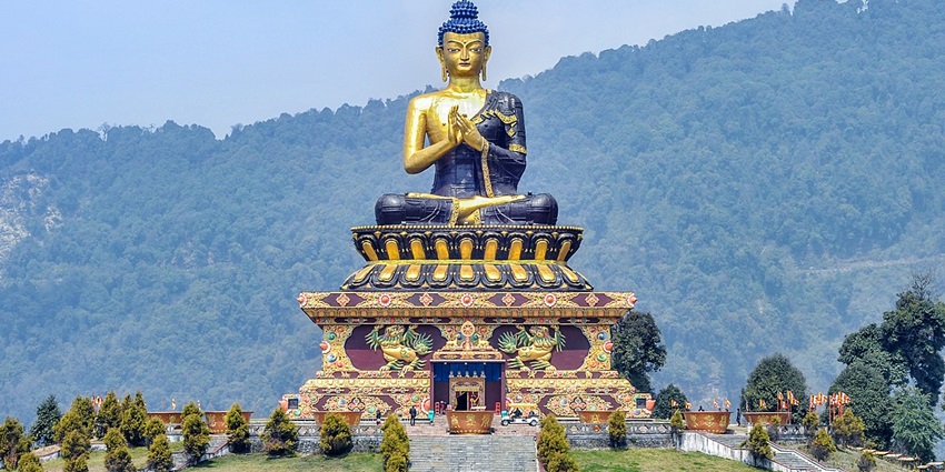 Explore the vibrant carvings on the magnificent Buddha statue at this park 