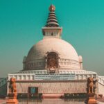 A picture of a peace pagoda located in the middle of the Indraprastha Park in Delhi on a sunny day