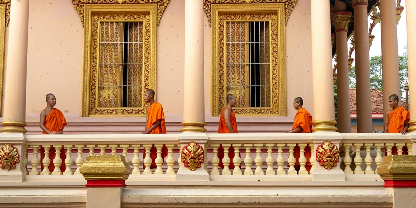 Buddhist temple in Namphake Village, monks standing - Dibru Saikhowa National Park.