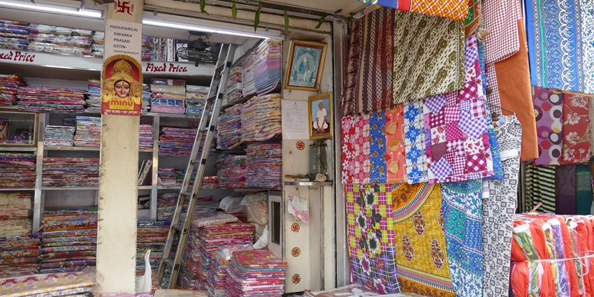 A picture of a small shop selling clothes and handloom products in Kolkata
