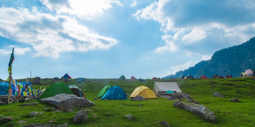 View of tents on the lush meadows of the picnic place, one of the exciting activities.