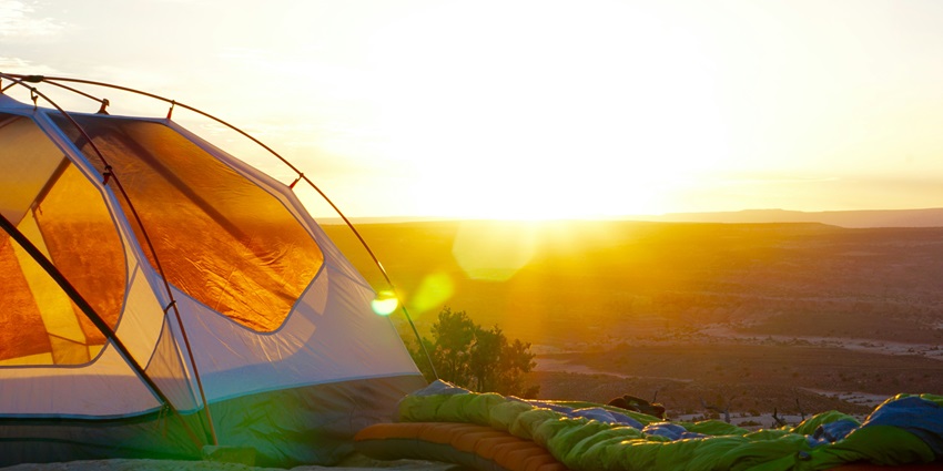 View of camping tent on cliff during golden hour - explore Maqbool Camping Resort
