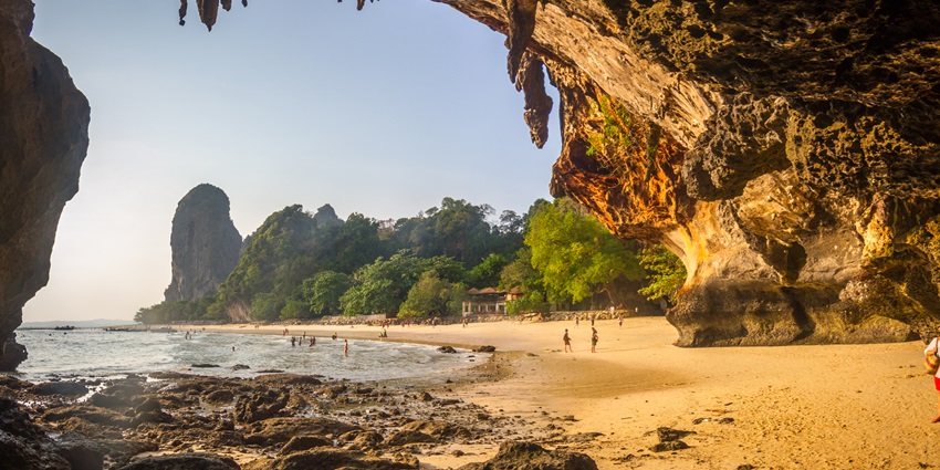 Phra Nang Cave Beach with dramatic cliffs, clear waters, and a unique cave entrance.