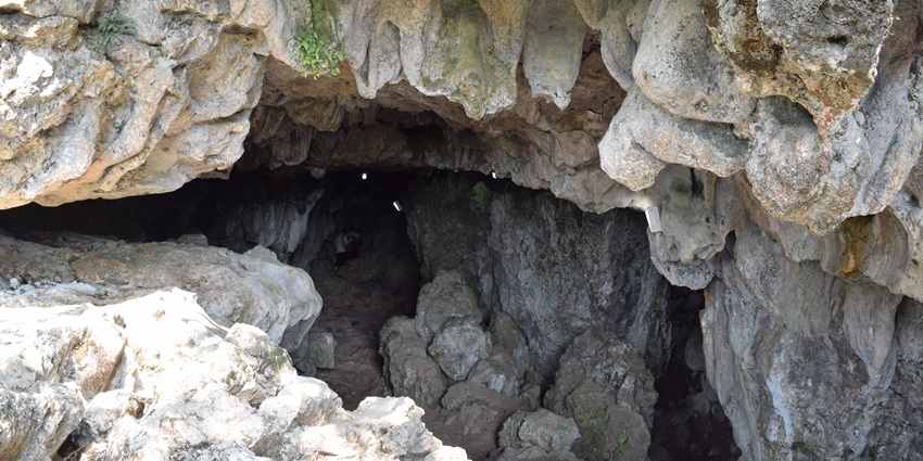 A cave entrance in Meghalaya with the cave going deep and dark inside the entrance
