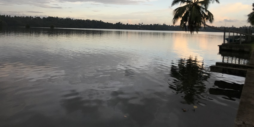 A scenic view of Bentota River, a picturesque abode to experience Bentota nightlife.