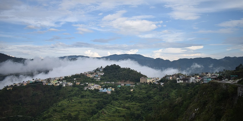 Aerial view of Chamba town around the lush green mountains - places to visit in Himachal Pradesh in February