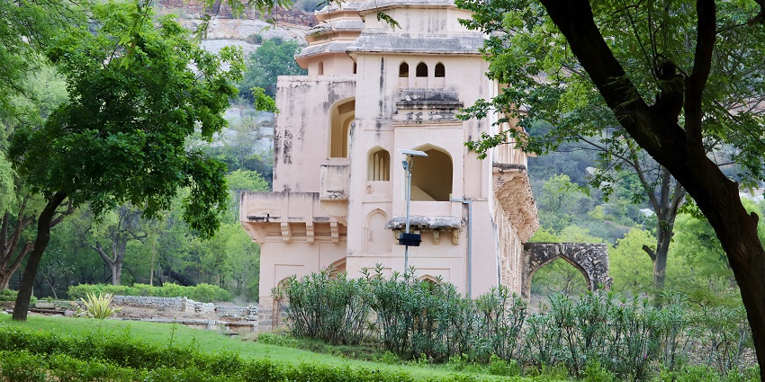 Scenic view of Chandragiri Fort with lush greenery and a clear blue sky.