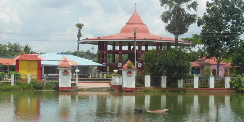 Distinctive temple with red dome honoring Tripura’s fourteen deities, Old Agartala