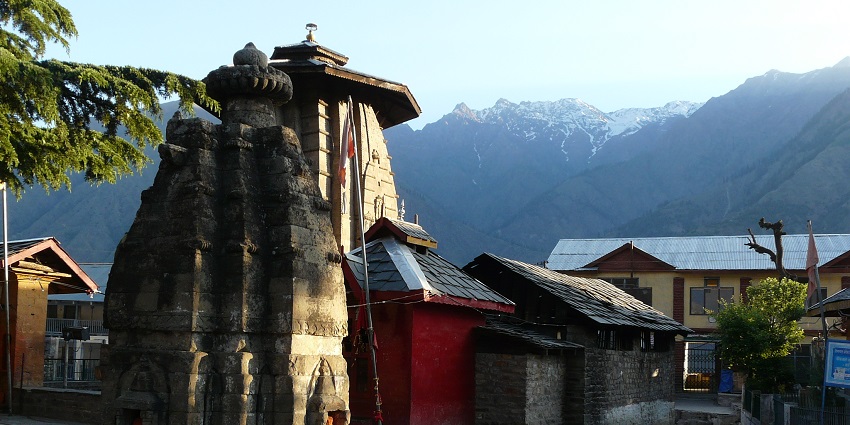 A picture of a holy shrine located amidst mountains in Bharmour, Himachal Pradesh.