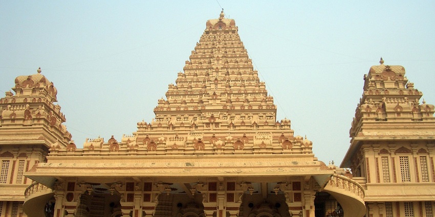 A frontal view of a spiritual building with traditional architecture and intricate designs