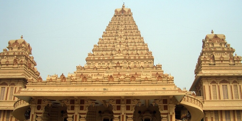 A frontal view of a spiritual building with traditional architecture and intricate designs