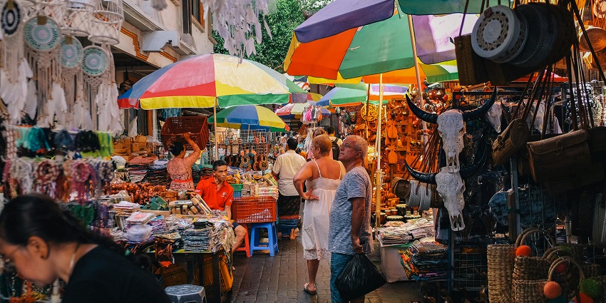 Shop for unique souvenirs at the famous Chiang Mai Night Bazaar located in Thailand.