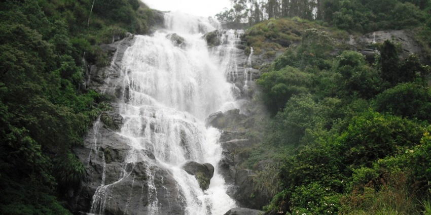 A serene view of the gushing waters of the Chinnakanal Waterfalls, a hotspot in Kerala.