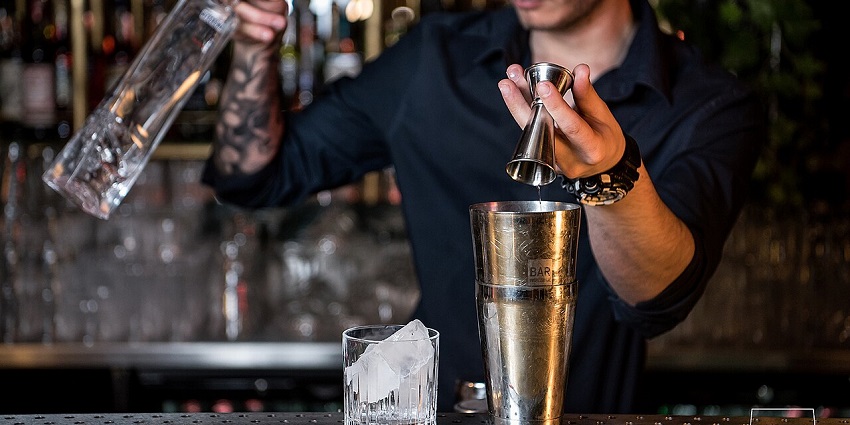 A bartender preparing cocktail at a bar