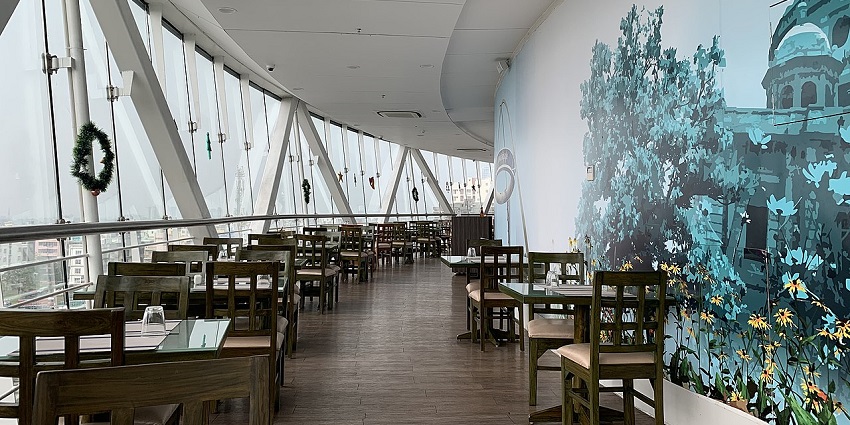 A picture of the interiors of a restaurant in Shillong with a beautiful wall painting