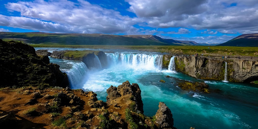 Cliff waterfalls cascading down a steep rock face into a pool below - waterfalls in Nagaland.
