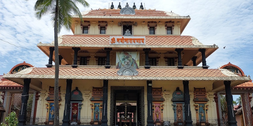 Gopuram of Cochin Thirumala Devaswom Temple featuring intricate carvings and bright colours