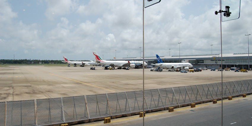 Aerial view of Bandaranaike International Airport with planes on the runway.
