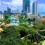 A scenic view of the Colombo skyline in Sri Lanka with its lush greenery and majestic buildings