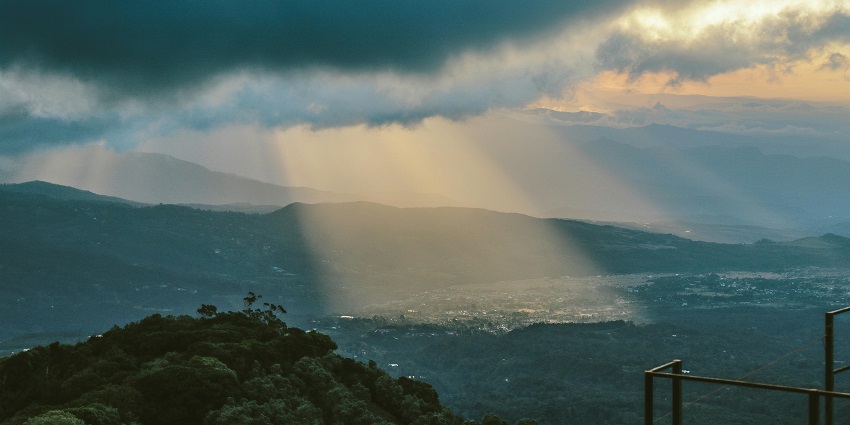 An image of sunlight beaming through the clouds straight after the rain showers.