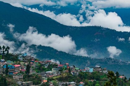 A bird’s eye view of the lush greenery and terraced fields dotted with colourful houses.