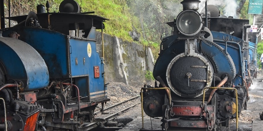 Darjeeling Himalayan Railway, the toy train chugging through scenic mountain routes with charming vintage carriages.
