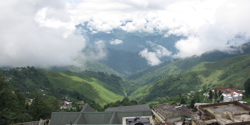Darjeeling in December with crisp winter air, green peaks, and festive holiday vibes.