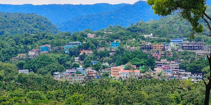 Panoramic view of the beautiful street of Dawki which is surrounded by the dense forest