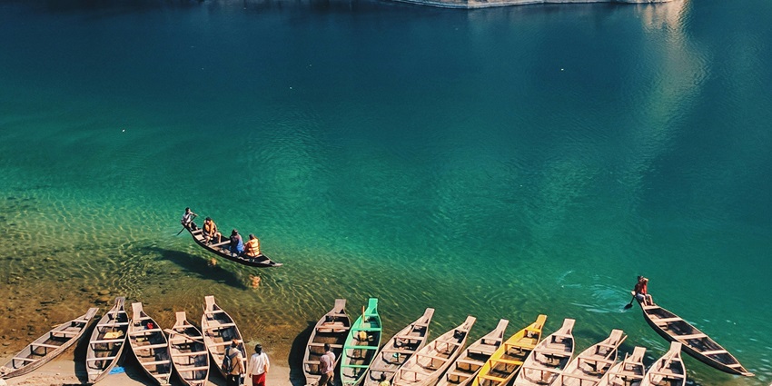 Picturesque view of colourfu boats near the body of water - Dawki, Meghalaya