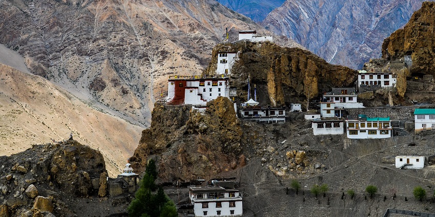 A picture of Dhankar Monastery perched atop amidst the rustic mountains and serenity.