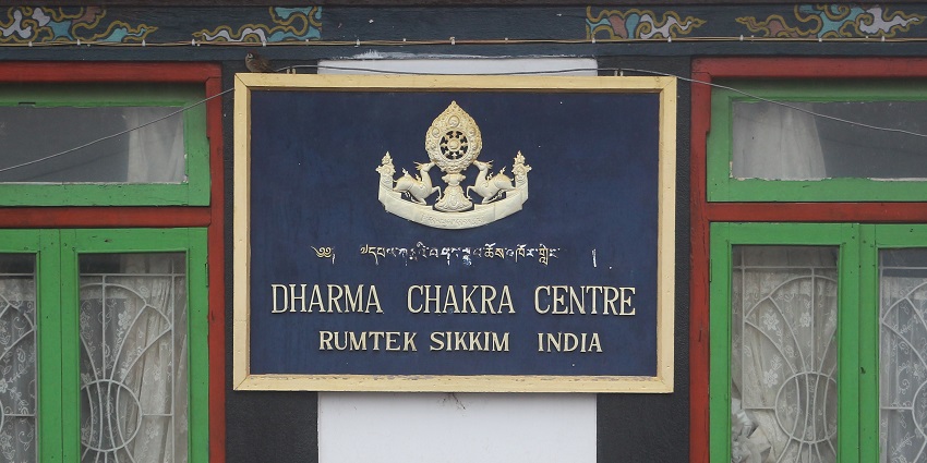 A sign board in a Sikkim monastery that says, “Dharma Chakra Centre