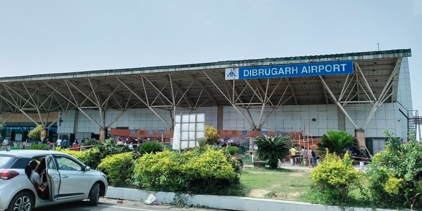 Image of Dibrugarh Airport from outside view, nestled in a picturesque landscape of Assam.