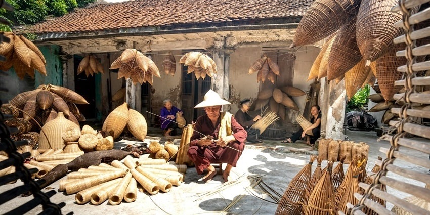 Native people in a village making traditional wicker products–Things to see in Dimapur